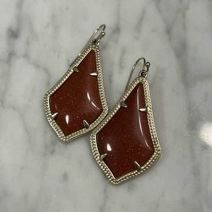 burnt orange small kendra scott earrings with sparkles